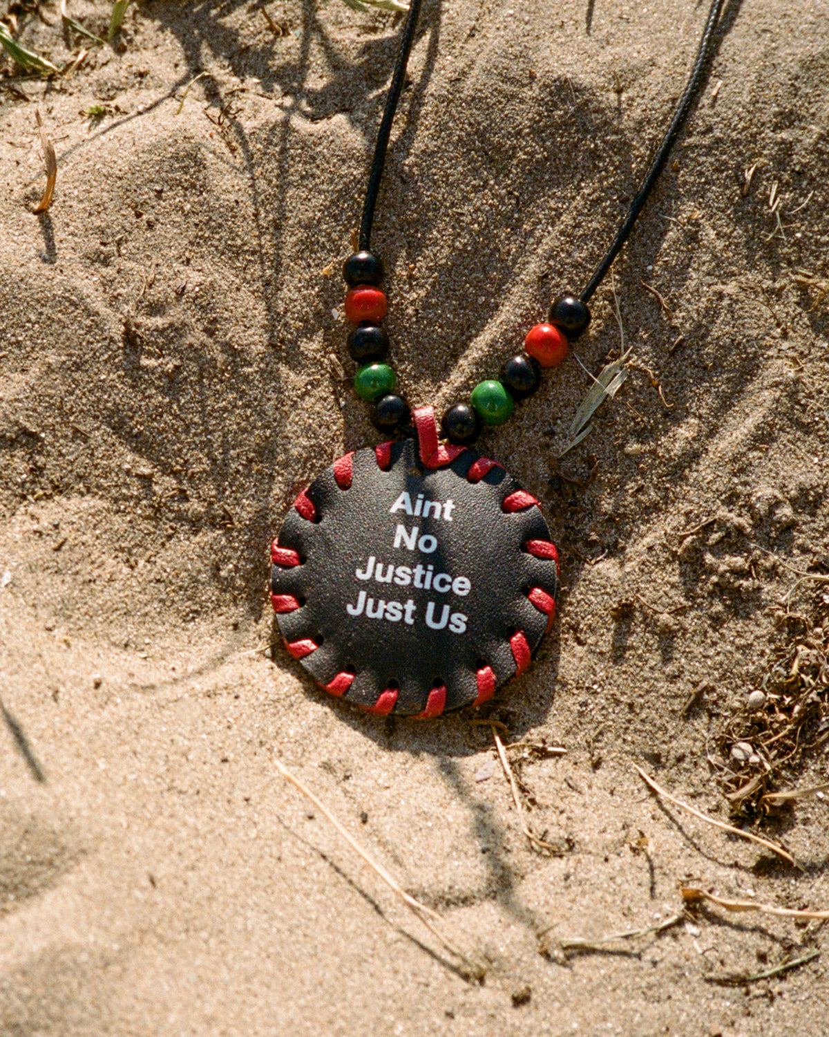 Red black deals and green necklace