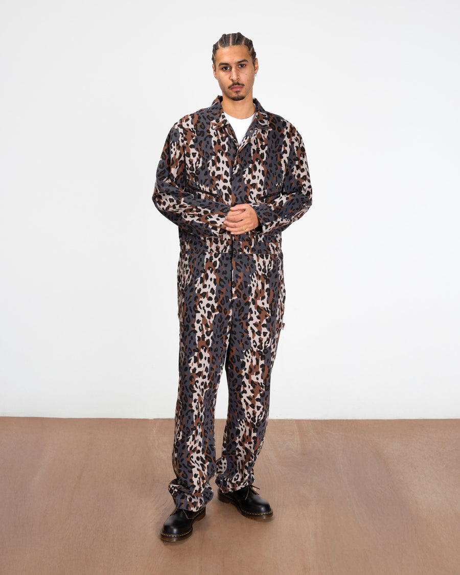 full body model shot of the leopard boiler suit styled with boots