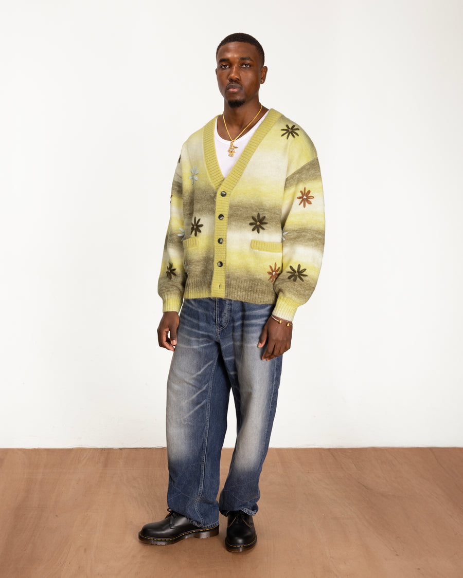 full body model shot of the Peace & Love Knitted Cardigan styled with baggy jeans and boots